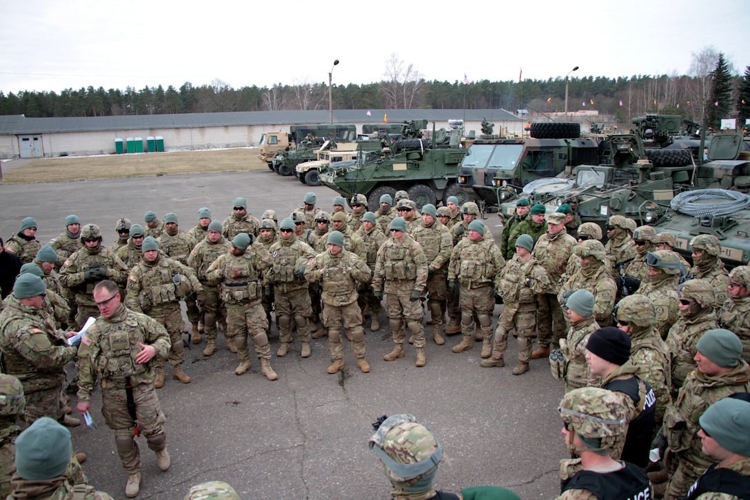 U.S. logistics soldiers and infantrymen prepare for convoy operations during Operation Dragoon Ride, an 1,800-kilometer road march from locations in Estonia, Latvia, Lithuania and Poland to Rose Barracks, Vilseck, March 23, 2015. The ride is the 2nd Cavalry Regiment’s capstone exercise for its rotation at Operation Atlantic Resolve, where soldiers test their skills and equipment, and greet communities from NATO allied nations along the way. The soldiers are assigned to the 16th Sustainment Brigade and the infantrymen are assigned the 2nd Cavalry Regiment.