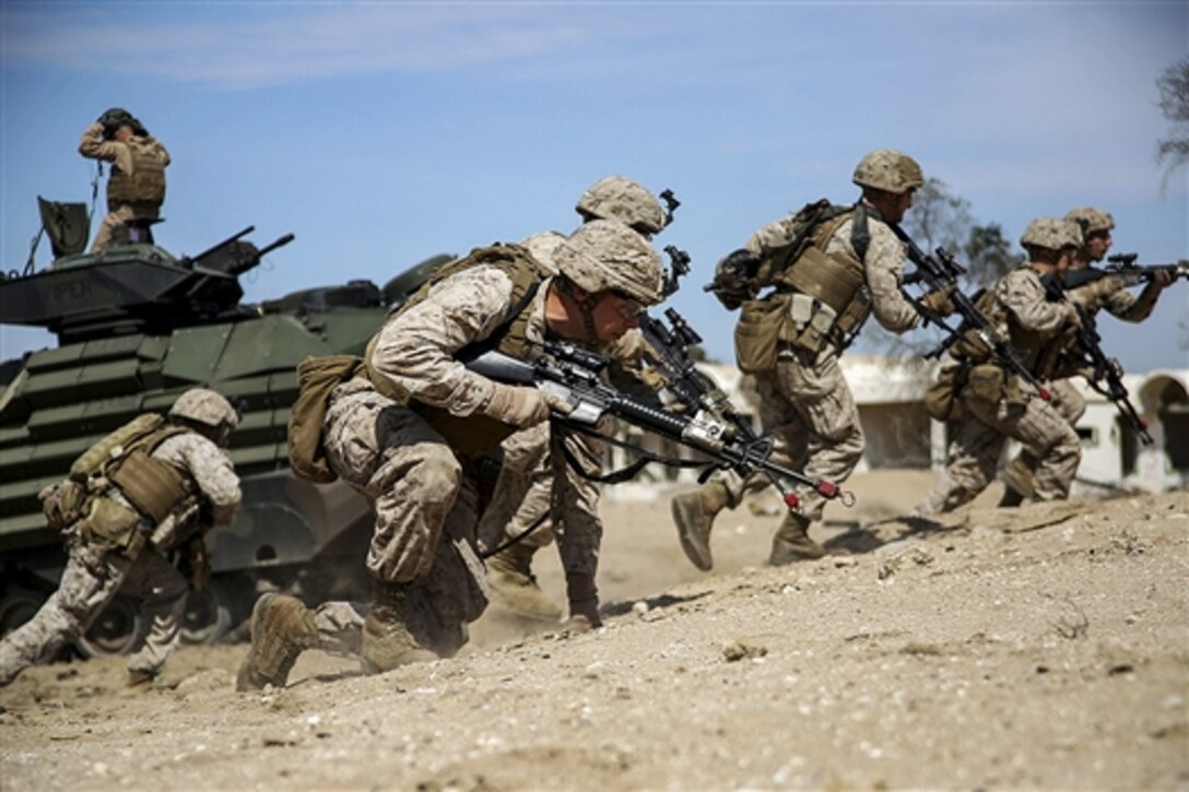 U.S. Marines assault a simulated objective during Exercise Eagle Resolve 2015 on Failaka Island, Kuwait, March 24, 2015.  