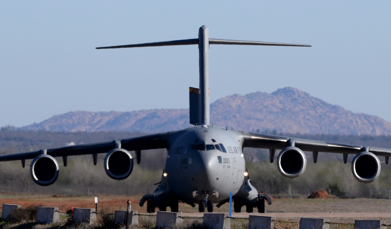 A U.S. Air Force C-17 Globemaster III cargo aircraft taxis down the runway after training at Altus Air Force Base, Oklahoma, March 26, 2015. Altus AFB is the training base for all C-17 aircrew members, preparing them for real-world missions. (U.S. Air Force photo by Airman 1st Class Nathan Clark)