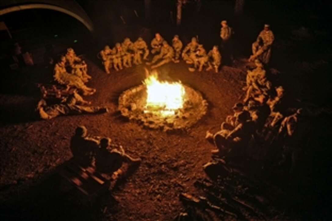 U.S. soldiers enjoy the warmth of a fire after a 96-hour training exercise in Boeblingen, Germany, March 26, 2015.