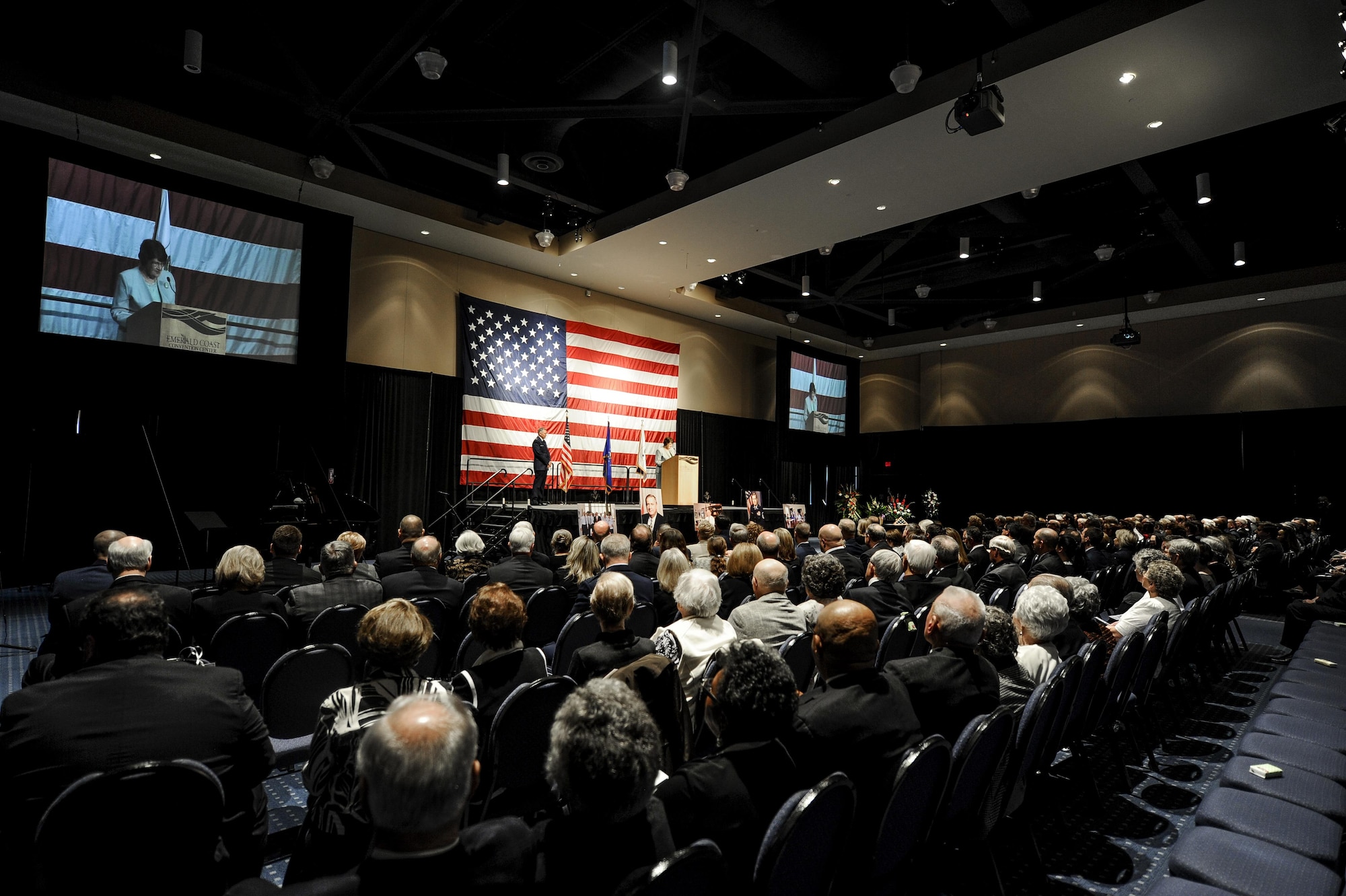 Mrs. Alice Coffman, Enlisted Village resident, speaks during Chief Master Sgt. of the Air Force #9 James C. Binnicker’s celebration of life ceremony at the Emerald Coast Convention Center, Fort Walton Beach, Fla., March 28, 2015. Binnicker spent 15 years as the CEO and president of the Air Force Enlisted Village in Shalimar, Fla., providing more than 400 residents a place to call home. (U.S. Air Force photo/Senior Airman Christopher Callaway)