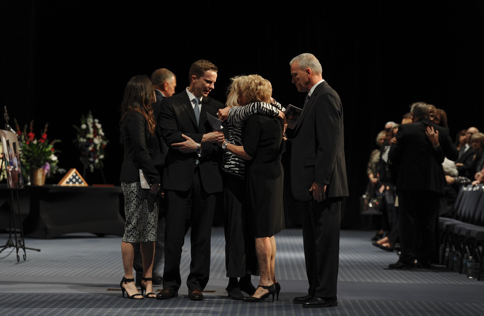 Family members of Chief Master Sgt. of the Air Force #9 James C. Binnicker mourn during his celebration of life ceremony at the Emerald Convention Center, Fort Walton Beach, Fla., March 28, 2015. During his tenure as the ninth chief master sergeant of the Air Force, Binnicker led the transformation from the Airman Performance Report to the Enlisted Performance Report, and developed the performance feedback system. He also worked to have master sergeants admitted to the Air Force Senior NCO Academy, and to increase the opportunities for minorities and women throughout the Air Force. (U.S. Air Force photo/Senior Airman Christopher Callaway)