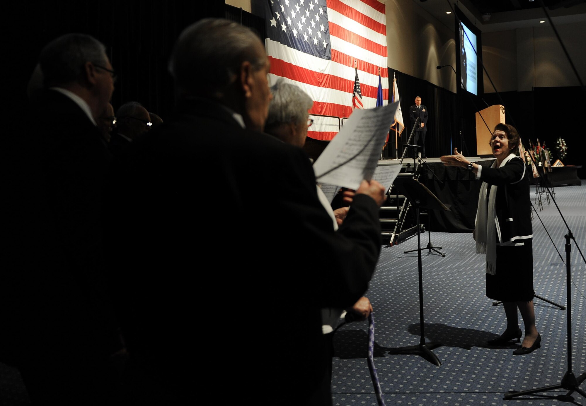 The Bob Hope Village Choir sings during Chief Master Sgt. of the Air Force #9 James C. Binnicker’s celebration of life ceremony at the Emerald Coast Convention Center, Fort Walton Beach, Fla., March 28, 2015. More than 1,000 people attended Binnicker’s celebration of life ceremony. He died March 21 in Calhoun, Ga. He was 76 years old. A memorial service and interment will be at Arlington National Cemetery, Virginia, at a later date. (U.S. Air Force photo/Senior Airman Christopher Callaway)