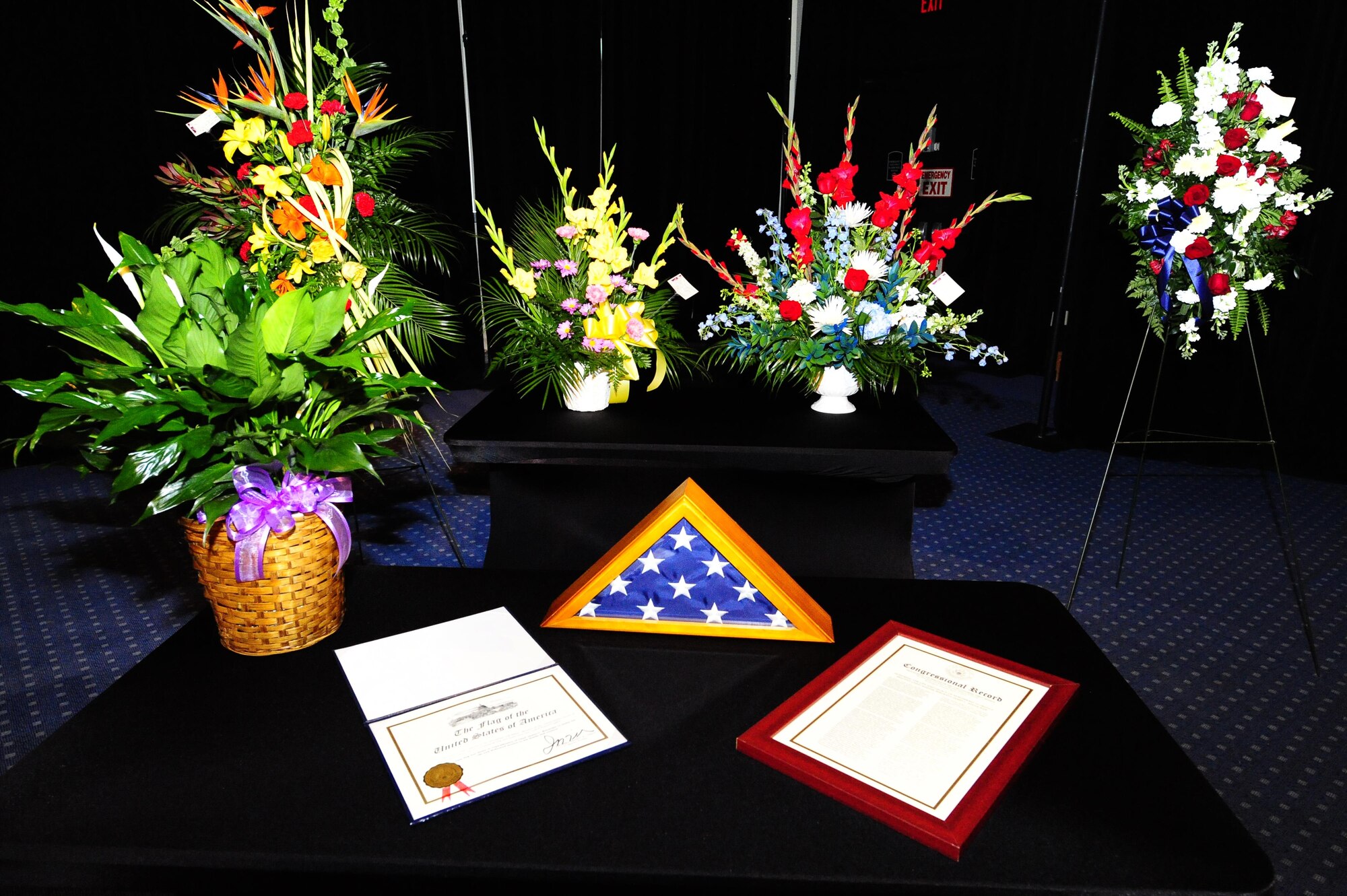 A flower display surrounds Chief Master Sgt. of the Air Force #9 James C. Binnicker’s awards and decorations during his celebration of life ceremony at the Emerald Coast Convention Center, Fort Walton Beach Fla., March 28, 2015. Binnicker entered the Air Force in August 1957 as a life support specialist.  He retired Aug. 1, 1990, after 33 years of service. A memorial service and interment will be at Arlington National Cemetery, Virginia, at a later date. (U.S. Air Force photo/Airman 1st Class Andrea Posey)
