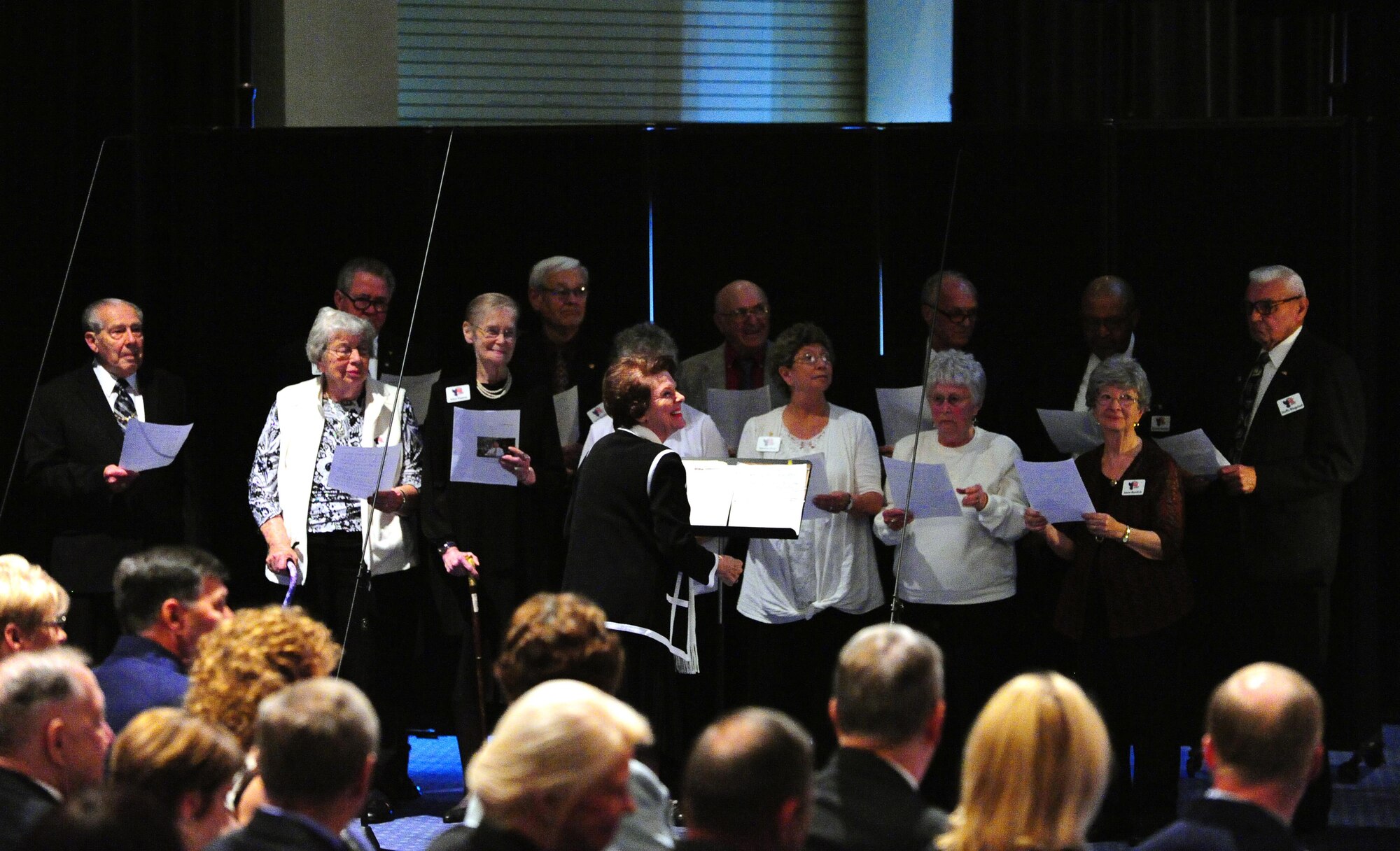 The Bob Hope Village Choir sings during Chief Master Sgt. of the Air Force #9 James C. Binnicker’s celebration of life ceremony at the Emerald Coast Convention Center, Fort Walton Beach Fla., March 28, 2015. More than 1,000 people attended Binnicker's celebration of life ceremony. He died March 21 in Calhoun, Ga. He was 76 years old. A memorial service and interment will be at Arlington National Cemetery, Virginia, at a later date. (U.S. Air Force photo/Airman 1st Class Andrea Posey)