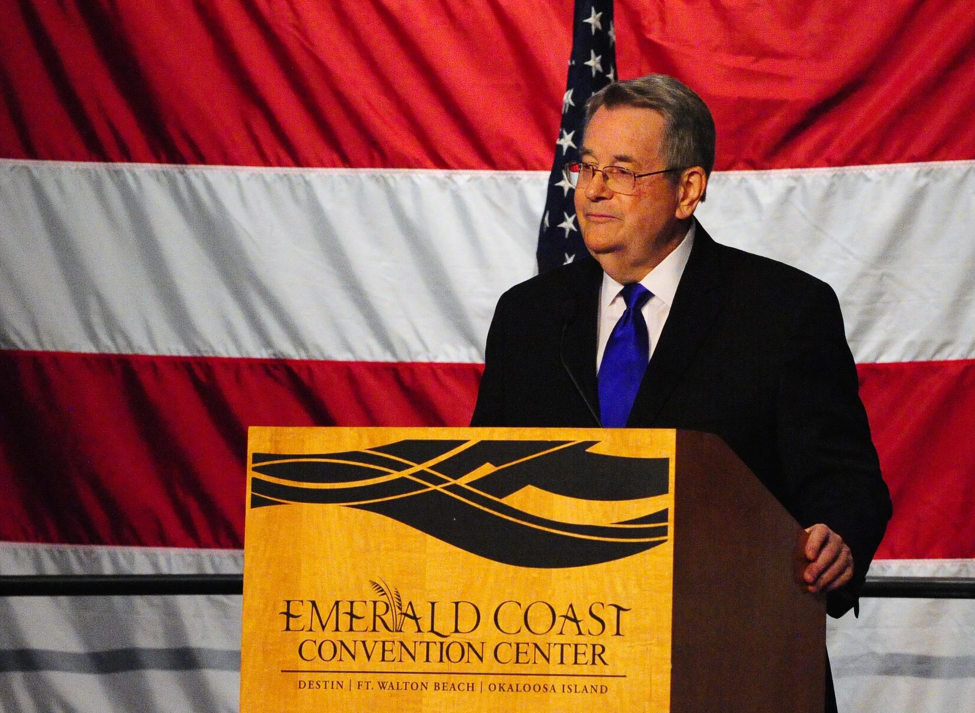 Sen. Don Gaetz speaks about his professional and personal friendship with Chief Master of Sgt. of the Air Force #9 James C. Binnicker during Binnicker’s celebration of life ceremony at the Emerald Coast Convention Center, Fort Walton Beach Fla., March 28, 2015. Binnicker spent 15 years as the CEO and president of the Air Force Enlisted Village in Shalimar, Fla., providing more than 400 residents a place to call home. (U.S. Air Force photo/Airman 1st Class Andrea Posey)