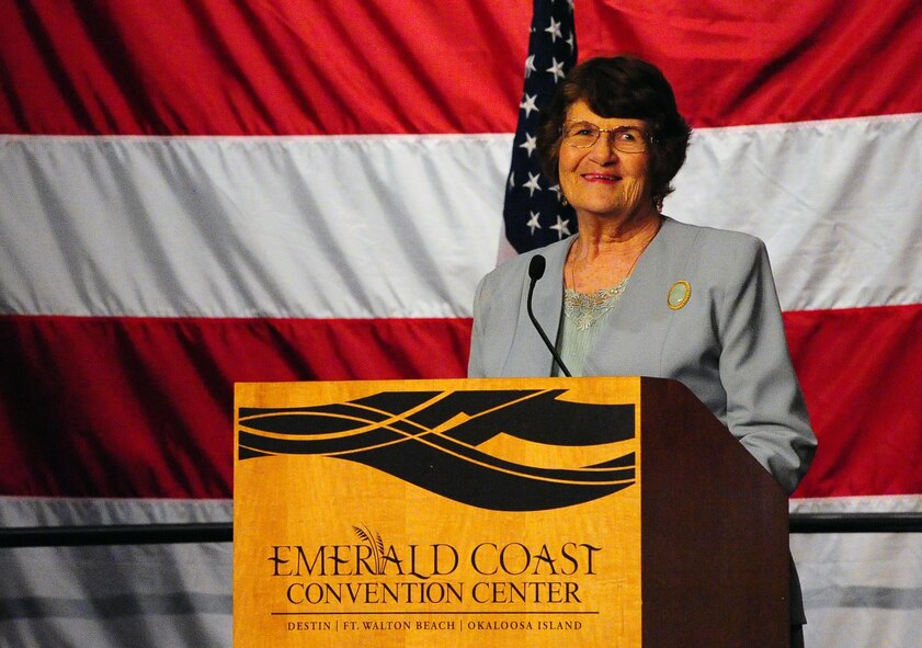 Mrs. Alice Coffman, resident of the enlisted village, speaks about her time with Chief Master of the Air Force #9 James C. Binnicker during his celebration of life ceremony at the Emerald Coast Convention Center, Fort Walton Beach Fla., March 28, 2015. Binnicker spent 15 years as the CEO and president of the Air Force Enlisted Village in Shalimar, Fla., providing more than 400 residents a place to call home. (U.S. Air Force photo/Airman 1st Class Andrea Posey)