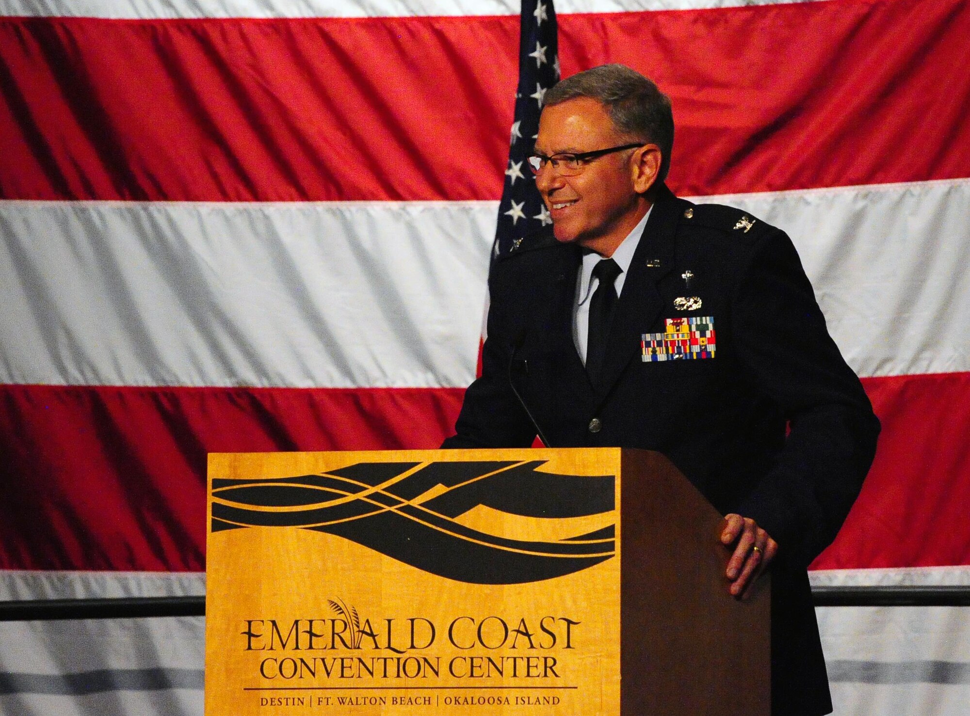 Chaplain (Col.) Steve Schaick, Air Education and Training Command Chaplain, speaks and leads prayer during Chief Master Sgt. of the Air Force #9 James C. Binnicker’s celebration of life ceremony at the Emerald Coast Convention Center, Fort Walton Beach Fla., March 28, 2015. More than 1,000 people attended Binnicker's celebration of life ceremony. He died March 21 in Calhoun, Ga. He was 76 years old. A memorial service and interment will be at Arlington National Cemetery, Virginia, at a later date. (U.S. Air Force photo/Airman 1st Class Andrea Posey)