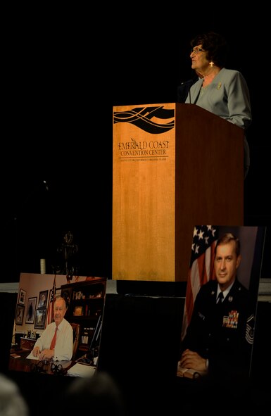 Mrs. Alice Coffman, a resident of the enlisted village, speaks at Chief Master Sgt. of the Air Force #9 James C. Binnicker’s celebration of life ceremony at the Emerald Coast Convention Center, Fort Walton Beach, Fla., March 28, 2015. Binnicker spent 15 years as the CEO and president of the Air Force Enlisted Village in Shalimar, Fla., providing more than 400 residents a place to call home. (U.S. Air Force photo by Airman Kai White/Released)


