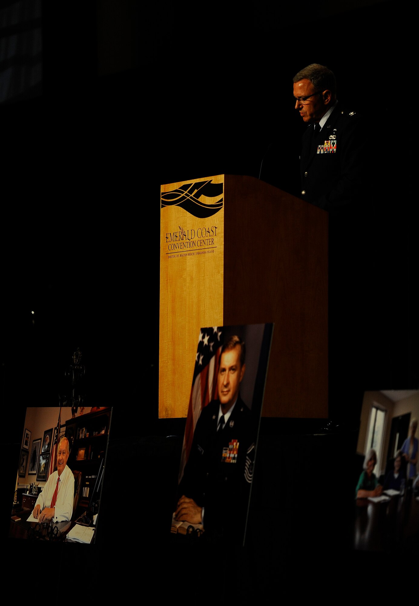 Chaplain (Col.) James Schaick gives the opening speech during Chief Master Sgt. of the Air Force #9 James C. Binnicker’s celebration of life ceremony at the Emerald Coast Convention Center, Fort Walton Beach, Fla., March 28, 2015. More than 1000 people attended Binnicker's celebration of life ceremony. He died March 21 in Calhoun, Ga. He was 76 years old. A memorial service and interment will be at Arlington National Cemetery, Virginia, at a later date. (U.S. Air Force photo by Airman Kai White/Released)