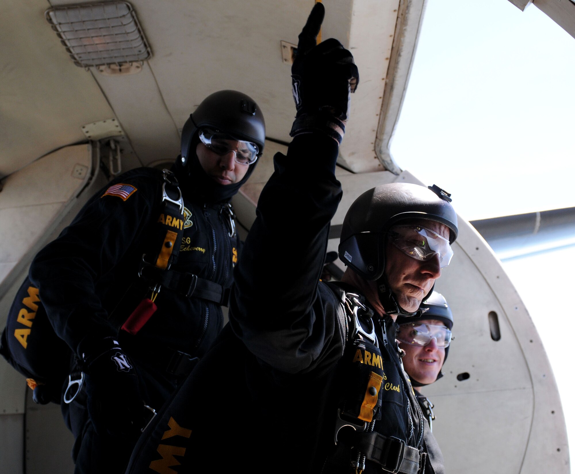Staff Sgt. Christopher Clark, U.S. Army Parachute Team “Golden Knights” Team Black demonstrator, relays information to the team’s crew chief via hand signals during their afternoon performance at the 2015 Keesler Air Show/Open House, March 28, 2015, Keesler Air Force Base, Miss. This was Keesler’s first air show since 2011, and featured 17 aerial acts, 27 static displays and was headlined by the U.S. Air Force Thunderbirds Aerial Demonstration Team. (U.S. Air Force photo by Airman 1st Class Duncan McElroy)