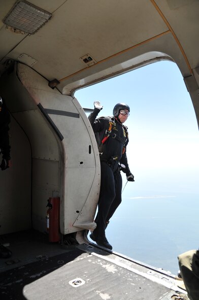 Army Sgt. Kenneth Severin, a member of the U.S. Army Golden Knights parachute team, jumps from the aircraft at over 12,500 feet during a parachute demonstration during the Keesler Air Force Base "Thunder on the Bay" Air Show and Open House March 28, 2015. (U.S. Air Force photo/Master Sgt. Jessica Kendziorek)