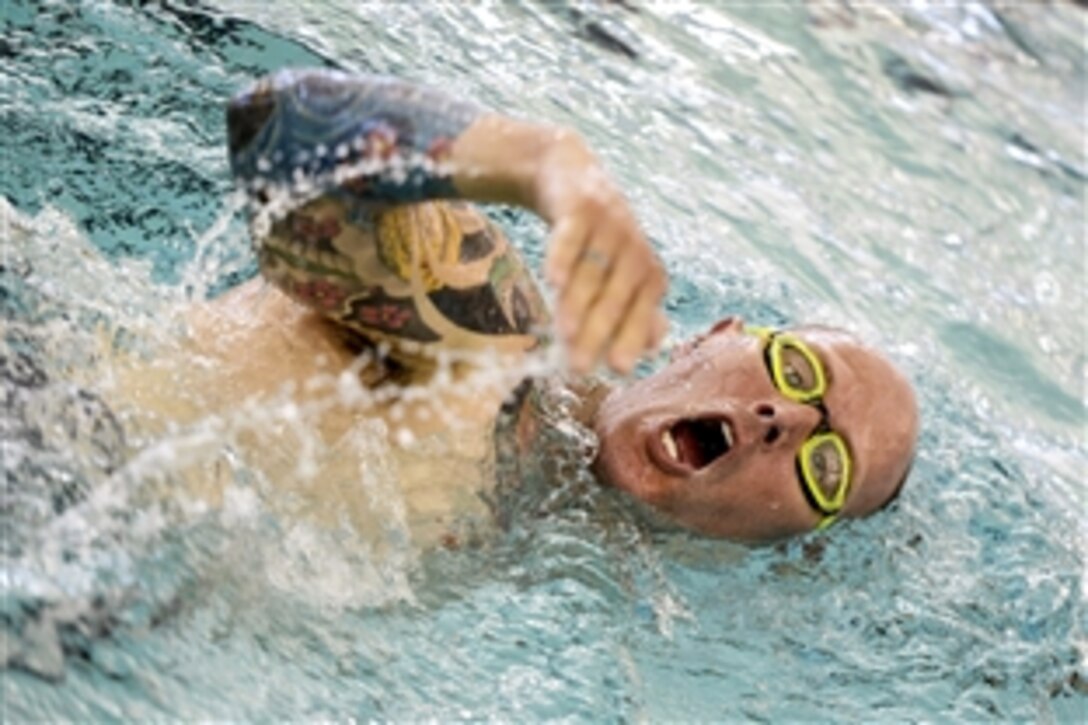Army Capt. Steve Bortle swims freestyle during practice for the Army Trials on Fort Bliss in El Paso, Texas, March 27, 2015. About 100 wounded, ill or injured soldiers and veterans are on the base to train and compete in athletic events through April 2. The trials help determine who will get a spot on the Army's team for the Defense Department's Warrior Games in June on Marine Corps Base, Quantico, Va.