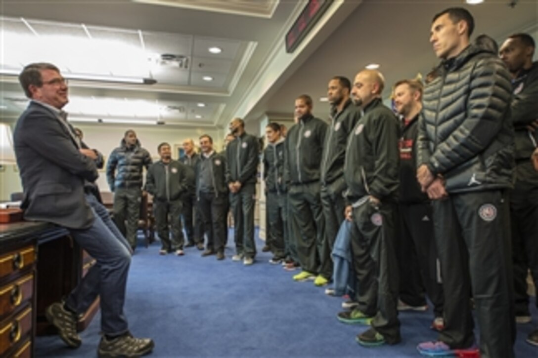 Defense Secretary Ash Carter meets with the NBA's Houston Rockets at the Pentagon, March 28, 2015. Earlier, the basketball stars visited the gravesites of fallen service members, met with an Army widow and laid a wreath at the Tomb of the Unknown Soldier at Arlington National Cemetery in Arlington, Va. 