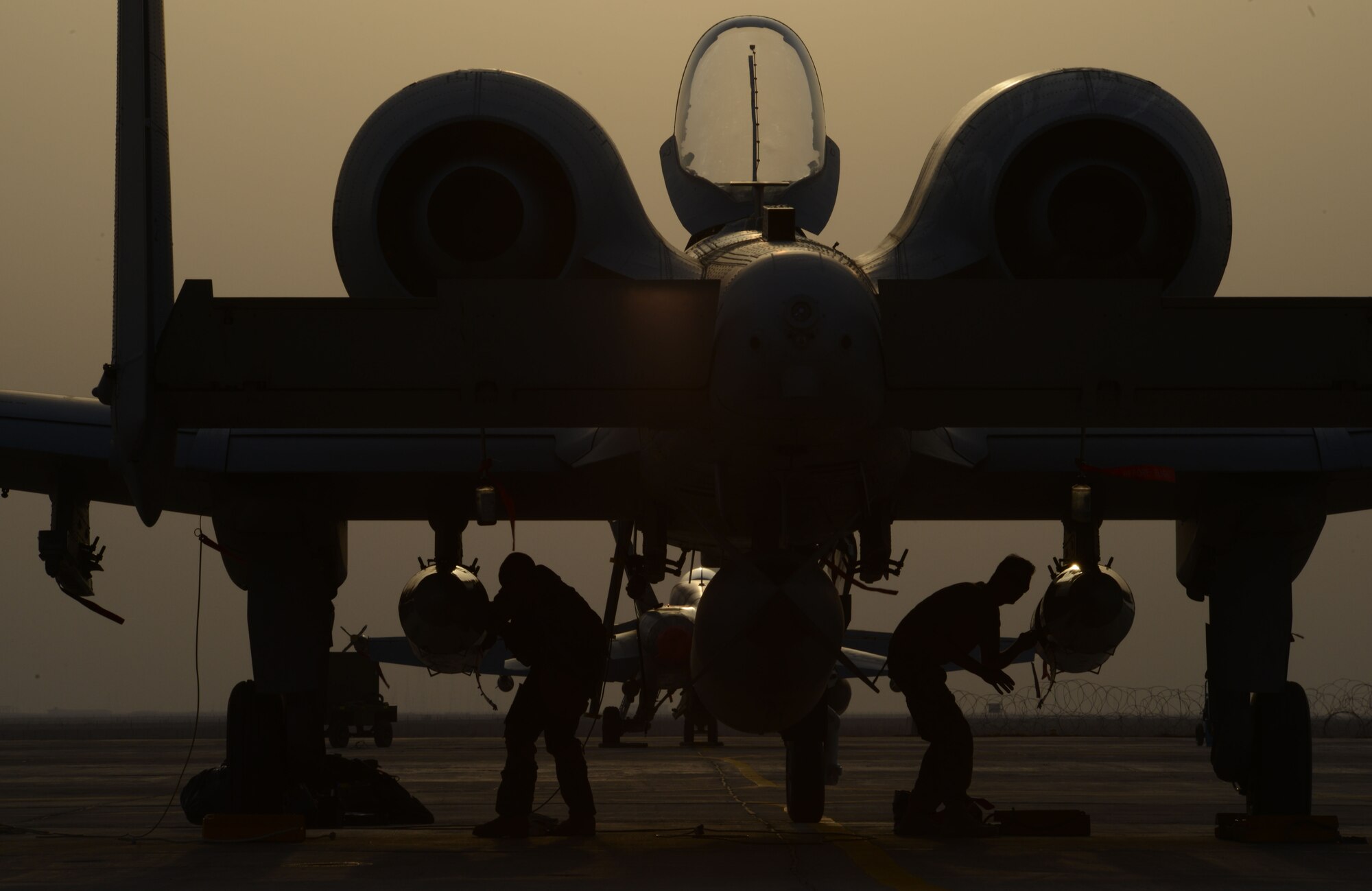 Airmen work on an A-10 Thunderbolt II from the 163rd Expeditionary Fighter Squadron after its arrival here in November. Since their arrival to the 332nd Air Expeditionary Group, A-10s have expended nearly 50,000 rounds of ammunition and dropped approximately 500 bombs and maverick missiles in support of Operation INHERENT RESOLVE. (U.S. Air Force photo by Tech. Sgt. Jared Marquis)