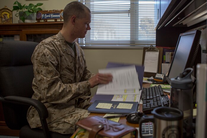 Navy Lt. David Hammond, a chaplain with the Marine Memorial Chapel reviews his daily schedule March 26, 2015, aboard Marine Corps Air Station Iwakuni, Japan. The chapel’s mission aboard station is to aid and enhance mission readiness by supporting emotional and spiritual fitness.