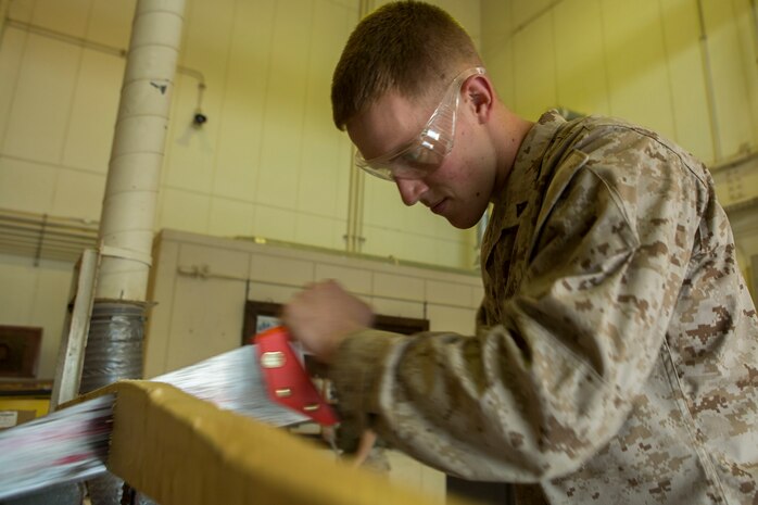 Lance Cpl. Nickolas Stafford, a combat engineer with Marine Wing Support Squadron 171, Engineer Company, combat engineer platoon, saws a piece of wood for a project currently under construction, March 26, 2015, aboard Marine Corps Air Station Iwakuni, Japan. The primary mission of combat engineers aboard station is to support Marine Aircraft Group 12 and station airfield operations along with the adjacent units of MAG-12, including those that are part of the Unit Deployment Program.