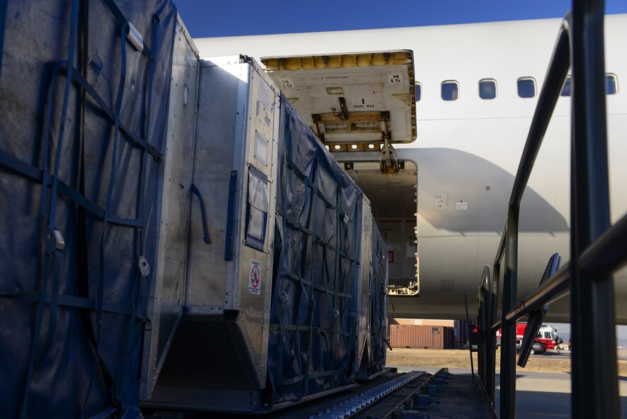 Baggage bins are positioned to be loaded into an aircraft March 12, 2015, at Osan Air Base, Republic of Korea. Baggage download and upload times have decreased since the implementation of the new process. (U.S. Air Force photo by Senior Airman David Owsianka)