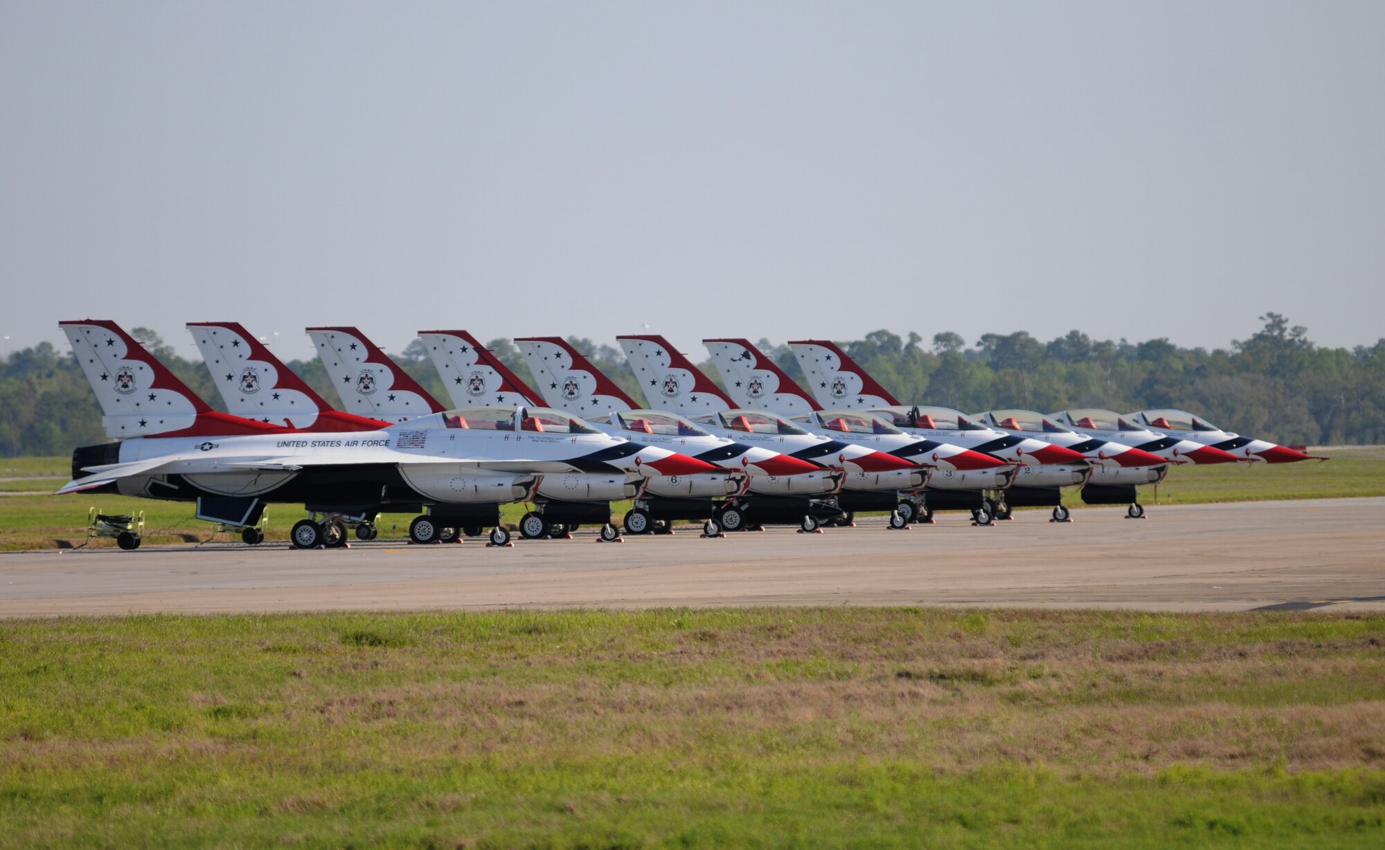 The U.S. Air Force Thunderbirds F-16 Fighting Falcons line the runway during Keesler’s 2015 Air Show/Open House March 29, 2015, at Keesler Air Force Base, Miss. The Thunderbirds headlined the two-day event held March 28-29.  Approximately 155,000 people were in attendance for the two-day show. (U.S. Air Force photo by Kemberly Groue)