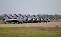 The U.S. Air Force Thunderbirds F-16 Fighting Falcons line the runway during Keesler’s 2015 Air Show/Open House March 29, 2015, at Keesler Air Force Base, Mississippi. The Thunderbirds headlined the two-day event held March 28-29.  Approximately 155,000 people were in attendance for the two-day show. (U.S. Air Force photo by Kemberly Groue)