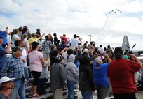 Crowds watch as the U.S. Air Force Thunderbirds perform during Keesler’s 2015 Air Show/Open House March 29, 2015, at Keesler Air Force Base, Mississippi. The Thunderbirds headlined the two-day event held March 28-29.  Approximately 155,000 people were in attendance for the two-day show. (U.S. Air Force photo by Kemberly Groue)