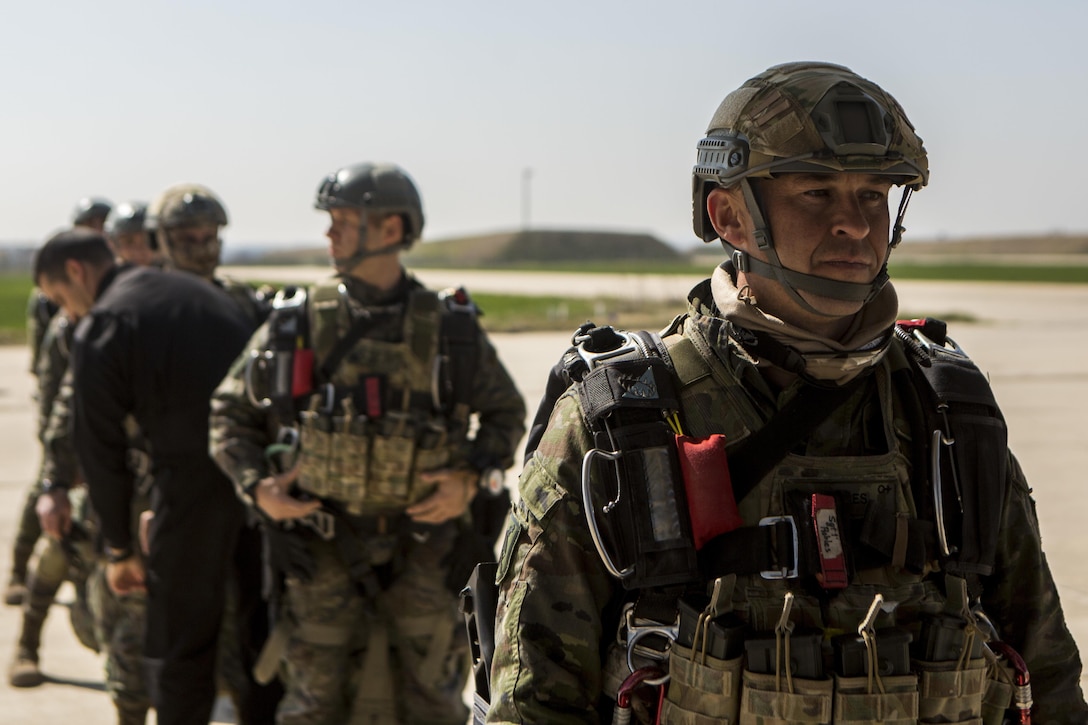 Service members with the Spanish Airborne are inspected by the jump master while waiting to board an MV-22 Osprey with Special-Purpose Marine Air-Ground Task Force Crisis Response-Africa, during a bilateral training exercise near Madrid, Spain, March 16, 2015. Approximately 350 Spanish paratroopers jumped and dropped cargo out of an MV-22 Osprey and a KC-130J Hercules as part of a combined training exercise to further improve relations and enhance interoperability between the two NATO allies. (U.S. Marine Corps photograph by Lance Cpl. Christopher Mendoza/Released)