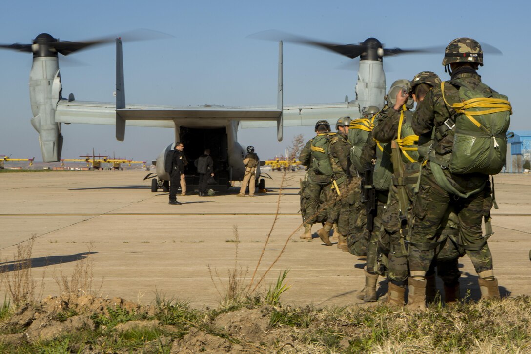 Service members with the Spanish Airborne Brigade wait to board an MV-22 Osprey with Special-Purpose Marine Air-Ground Task Force Crisis Response-Africa, during a bilateral training exercise near Madrid, Spain, March 16, 2015. Approximately 350 Spanish paratroopers jumped and dropped cargo out of an MV-22 Osprey and a KC-130J Hercules as part of a combined training exercise to further improve relations and enhance interoperability between the two NATO allies. (U.S. Marine Corps photograph by Lance Cpl. Christopher Mendoza/Released)