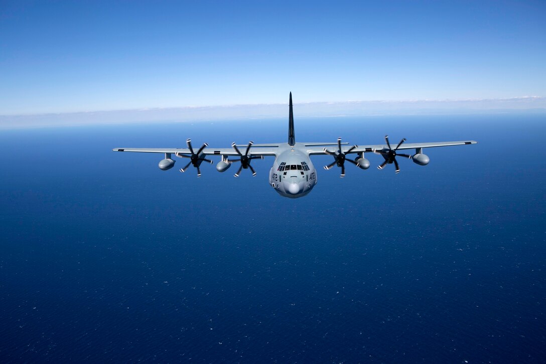 A KC-130J Hercules tanker with Special-Purpose Marine Air-Ground Task Force Crisis Response-Africa, trails a second KC-130J while conducting a formation flight near Moròn Air Base, Spain, March 25, 2015. The Hercules, largely used to transport assets and refuel additional aircraft, is utilized for crisis-response missions ranging from disaster relief and humanitarian aid to embassy evacuation and security operations. (U.S. Marine Corps photograph by 1st Lt. Danielle Dixon/Released)