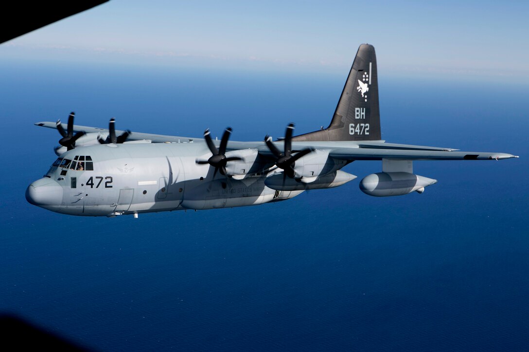 A KC-130J Hercules tanker with Special-Purpose Marine Air-Ground Task Force Crisis Response-Africa, is visible from the back ramp of a second KC-130J while conducting a formation flight near Moròn Air Base, Spain, March 25, 2015. The Hercules, largely used to transport assets and refuel additional aircraft, is utilized for crisis-response missions ranging from disaster relief and humanitarian aid to embassy evacuation and security operations. (U.S. Marine Corps photograph by 1st Lt. Danielle Dixon/Released)