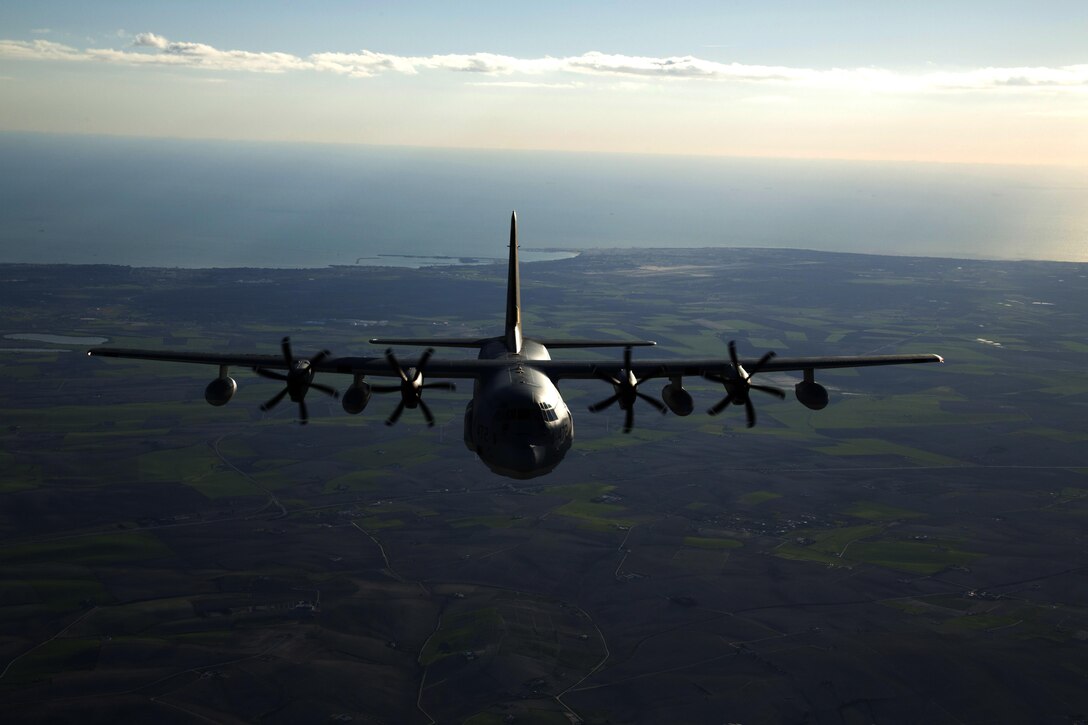 Two KC-130J Hercules tankers with Special-Purpose Marine Air-Ground Task Force Crisis Response-Africa, conduct a formation flight near Moròn Air Base, Spain, March 25, 2015. The Hercules went “feet dry” as it re-entered Spanish airspace after flying off the coast of Spain. (U.S. Marine Corps photograph by 1st Lt. Danielle Dixon/Released)