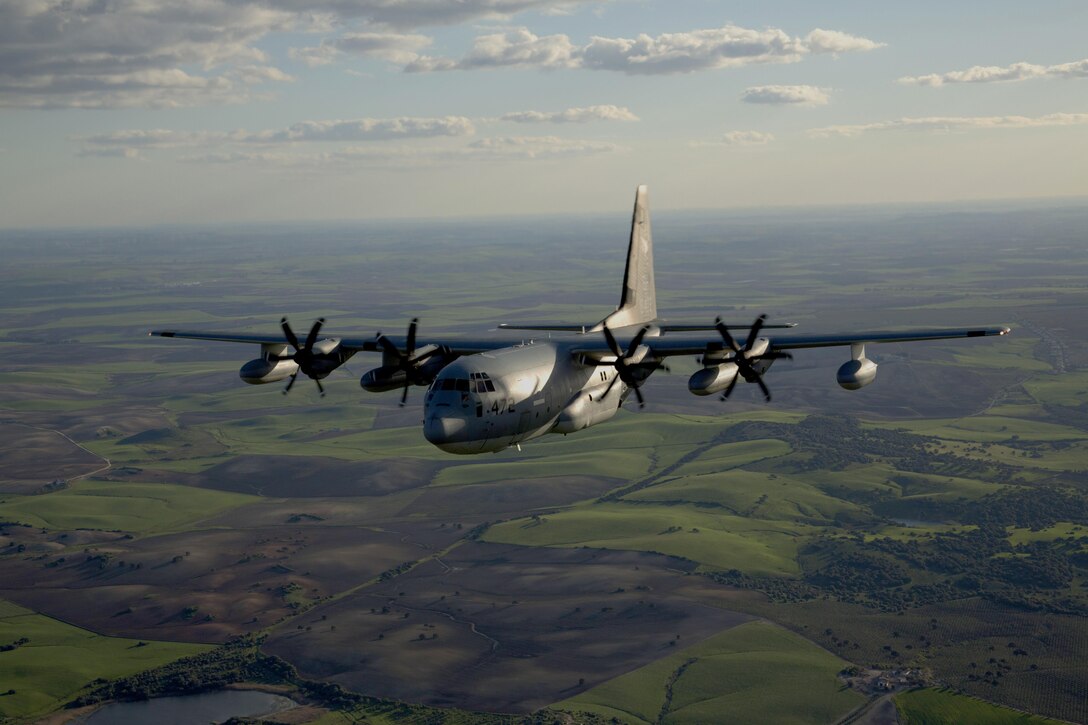 Two KC-130J Hercules tankers with Special-Purpose Marine Air-Ground Task Force Crisis Response-Africa, conduct a formation flight near Moròn Air Base, Spain, March 25, 2015. The Hercules, primarily utilized to transport assets or refuel other aircraft, is one of two platforms included in the aviation combat element of the SPMAGTF. (U.S. Marine Corps photograph by 1st Lt. Danielle Dixon/Released)