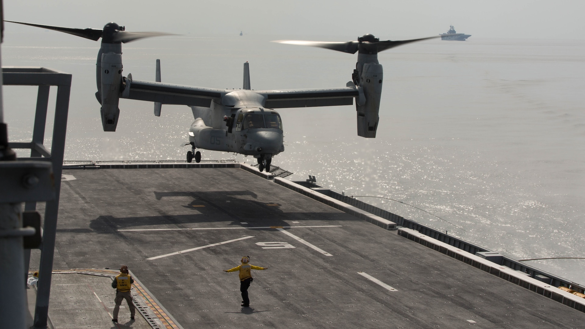 A U.S. Marine Corps MV-22B Osprey prepares to land on the flight deck of the Republic of Korea ship Dokdo (LPH 6111), at sea, March 26, 2015. This was the first time an Osprey has landed on a ROK amphibious assault ship. The aircraft is with Marine Medium Tiltrotor Squadron 262 (Reinforced), 31st Marine Expeditionary Unit. The Marines of the 31st MEU are embarked aboard the forward-deployed amphibious assault ship USS Bonhomme Richard (LHD 6) and are currently participating in Korean Marine Exchange Program 15 during the MEU’s annual Spring Patrol of the Asia-Pacific region. 
