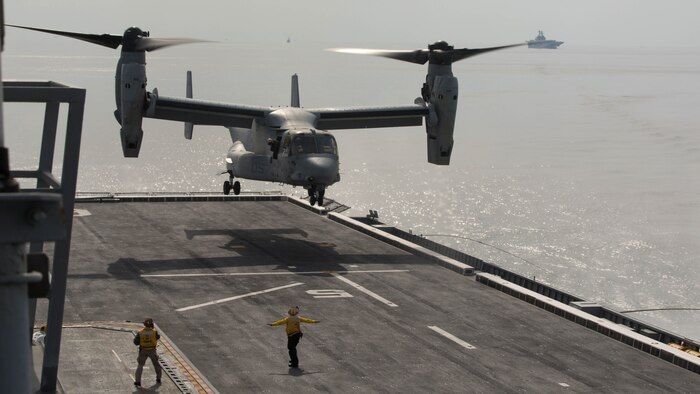 A U.S. Marine Corps MV-22B Osprey prepares to land on the flight deck of the Republic of Korea ship Dokdo (LPH 6111), at sea, March 26, 2015. This was the first time an Osprey has landed on a ROK amphibious assault ship. The aircraft is with Marine Medium Tiltrotor Squadron 262 (Reinforced), 31st Marine Expeditionary Unit. The Marines of the 31st MEU are embarked aboard the forward-deployed amphibious assault ship USS Bonhomme Richard (LHD 6) and are currently participating in Korean Marine Exchange Program 15 during the MEU’s annual Spring Patrol of the Asia-Pacific region. 
