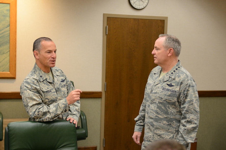 Brig. Gen. Scott Pleus, 56th Fighter Wing commander, discusses the future of Luke Air Force Base with Gen. Mark Welsh III, Chief of Staff of the U.S. Air Force. The general visited Luke to see the progress of the transition of Luke to an F-35 Lightning II joint strike fighter training base. (U.S. Air Force photo by Senior Airman James Hensley)