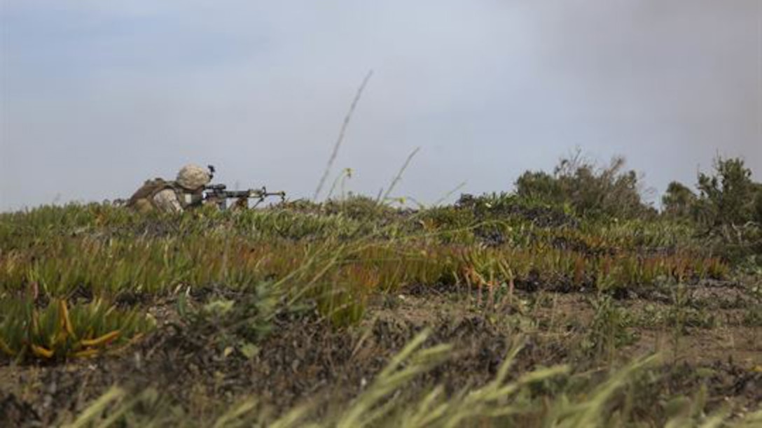 A U.S. Marine with Lima Company, Battalion Landing Team 3rd Battalion, 1st Marine Regiment, 15th Marine Expeditionary Unit, provides security during a raid on San Clemente Island, California, March 22, 2015. This raid was part of Composite Training Unit Exercise, preparing the Marines and sailors of the Essex Amphibious Ready Group and 15th MEU for their deployment. 