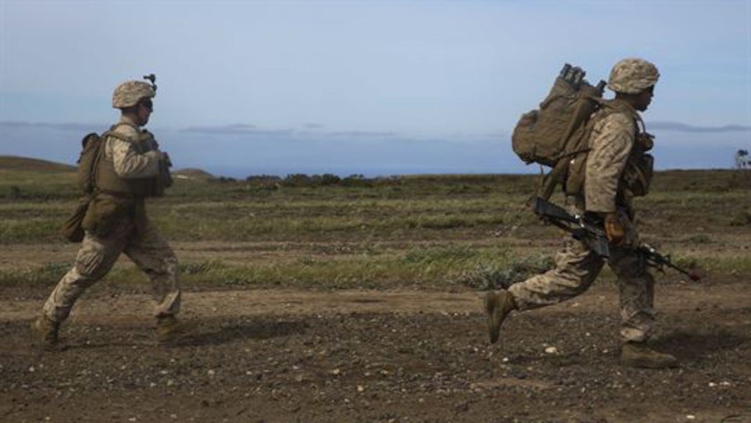 U.S. Marines with Lima Company, Battalion Landing Team 3rd Battalion, 1st Marine Regiment, 15th Marine Expeditionary Unit, run toward their objective during Composite Training Unit Exercise on San Clemente Island, California, March 22, 2015. As part of the 15th MEU’s ground combat element, the Marines practiced their urban movement and room clearing skills in preparation for their deployment. 