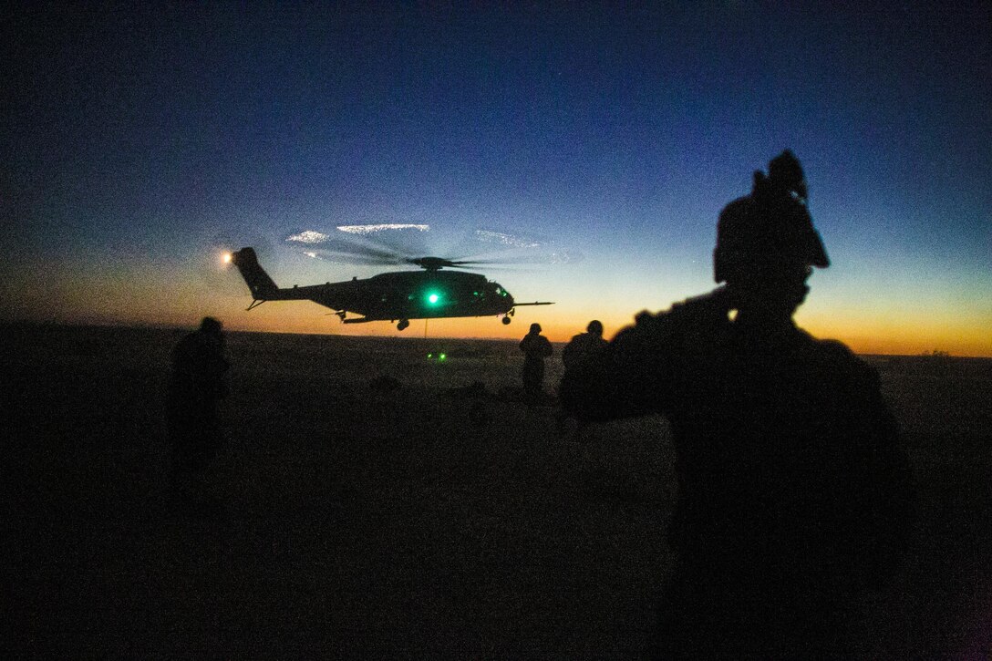 U.S. Marines attending the infantry officers course conduct fast rope training in preparation for Talon Reach during Weapons and Tactics Instructor Course (WTI 2-15) at Auxiliary Airfield 2 near Yuma, AZ., March 26, 2015. WTI is a seven-week event hosted by Marine Aviation Weapons and Tactics Squadron One (MAWTS-1) cadre. MAWTS-1 provides standardized tactical training and certification of unit instructor qualifications to support Marine aviation Training and Readiness and assists in developing and employing aviation weapons and tactics. (U.S. Marine Corps photo by Lance Cpl. Jodson B. Graves 2d MAW Combat Camera/Released)