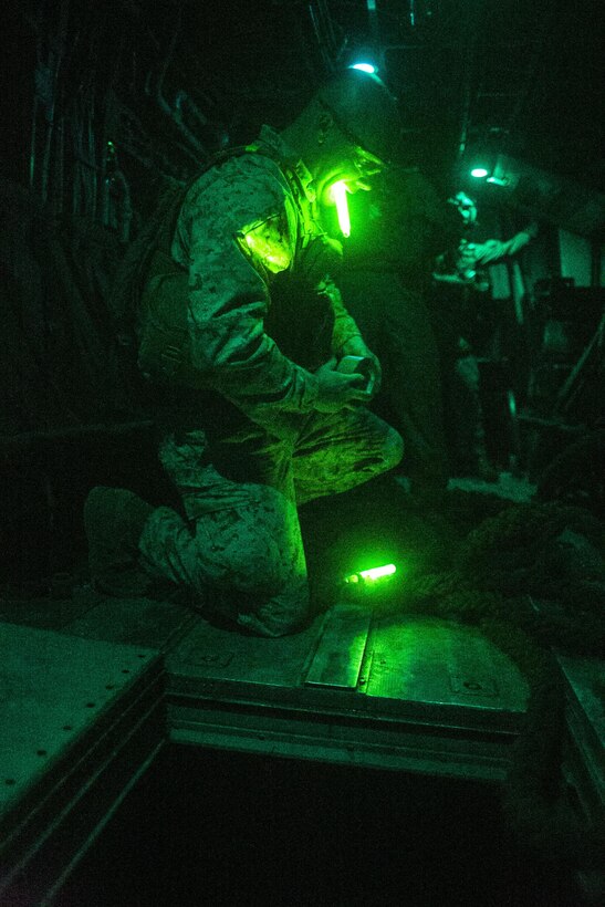 U.S. Marine Corps Sgt. David W. Berry, a helicopter rope suspension technique master attending the infantry officers course, attaches a rope to a CH53E Super Stallion during fast rope training in preparation for Talon Reach during Weapons and Tactics Instructor Course (WTI 2-15) at Auxiliary Airfield 2 near Yuma, AZ., March 26, 2015. WTI is a seven-week event hosted by Marine Aviation Weapons and Tactics Squadron One (MAWTS-1) cadre. MAWTS-1 provides standardized tactical training and certification of unit instructor qualifications to support Marine aviation Training and Readiness and assists in developing and employing aviation weapons and tactics. (U.S. Marine Corps photo by Lance Cpl. Jodson B. Graves 2d MAW Combat Camera/Released)