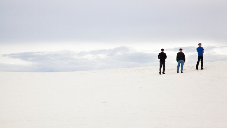 Sgt. Maj. Justin Lehew, the Training and Education Command Sergeant Major, and two other Marines looked at the dunes making up the White Sands National Monument, New Mexico March 21. These dunes of white spread for 200 miles in all directions and can be seen from space. The sand is held in place do to the large underground lake, so these pristine dunes never shift outside of the circumference of this white blemish on the face of the planet.