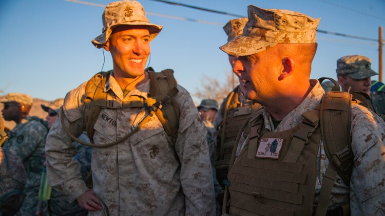 Sgt. Maj. Justin Lehew, the Training and Education Command Sergeant Major, speaks to a few Marine during the start of the Bataan Memorial Death March at White Sand Missile Range, New Mexico March 22. The event is the 73rd commemoration of the Bataan Death March when more than 60,000 American and Filipino prisoners of war endured a 60-mile forced march. These men endured severe physical abuse at the hands of their captors the Japanese Imperial army, many succumbing to the wounds and abuse they endured on the trek.