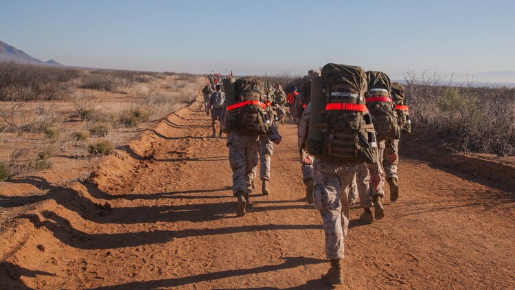 Members of a Navy JROTC program participate in the Bataan Memorial Death March at White Sand Missile Range, New Mexico March 22. The event is the 73rd commemoration of the Bataan Death March when more than 60,000 American and Filipino prisoners of war endured a 60-mile forced march. These men endured severe physical abuse at the hands of their captors the Japanese Imperial army, many succumbing to the wounds and abuse they endured on the trek.