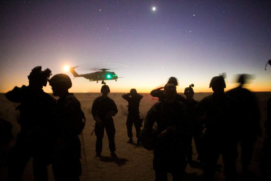 U.S. Marines attending the infantry officers course conduct fast rope training in preparation for Talon Reach during Weapons and Tactics Instructor Course (WTI 2-15) at Auxiliary Airfield 2 near Yuma, AZ., March 26, 2015. WTI is a seven-week event hosted by Marine Aviation Weapons and Tactics Squadron One (MAWTS-1) cadre. MAWTS-1 provides standardized tactical training and certification of unit instructor qualifications to support Marine aviation Training and Readiness and assists in developing and employing aviation weapons and tactics. (U.S. Marine Corps photo by Lance Cpl. Jodson B. Graves 2d MAW Combat Camera/Released)