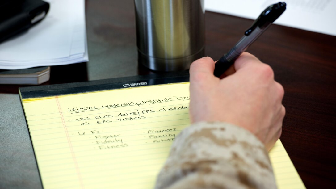 A Marine takes notes during a Leadership Development Program workshop at Marine Corps Base Quantico, Virginia, March 18, 2015. The goal of the workshop was to provide training to commanders and "key leaders" from Headquarters and Service Battalion to implement a unit leadership development program.
