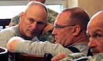 Col. Michael Fortune, commander of the Missouri National Guard's ADT IV, left, and Col. Craig Bargfrede, commander of the Iowa National Guard's 734th Agri-Business Development Team, conduct a meeting of key leaders from the two ADTs at Camp Atterbury, Ind. The two ADTs are deploying to adjacent provinces in Afghanistan later this summer.