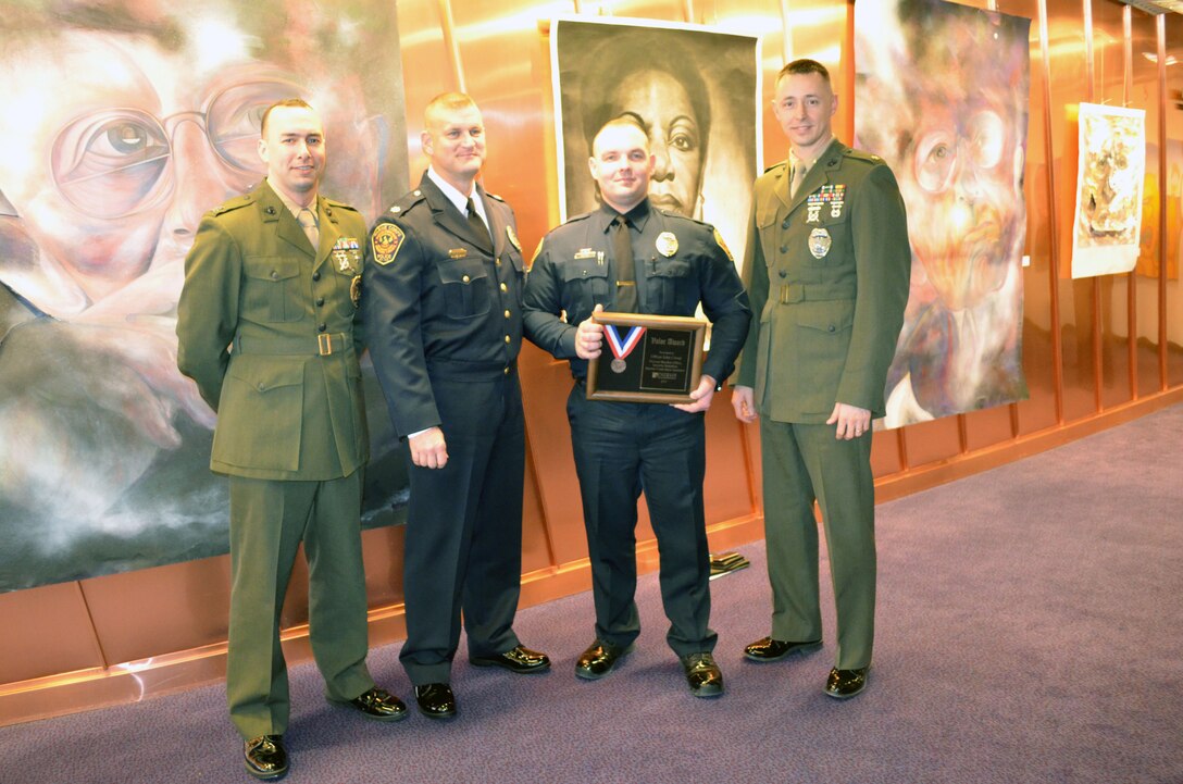 Officer John Covey, of the Marine Corps Base Quantico Provost Marshal Office, was honored during an award ceremony on March 18 that recognized 21 police officers from Prince William County for valor. 