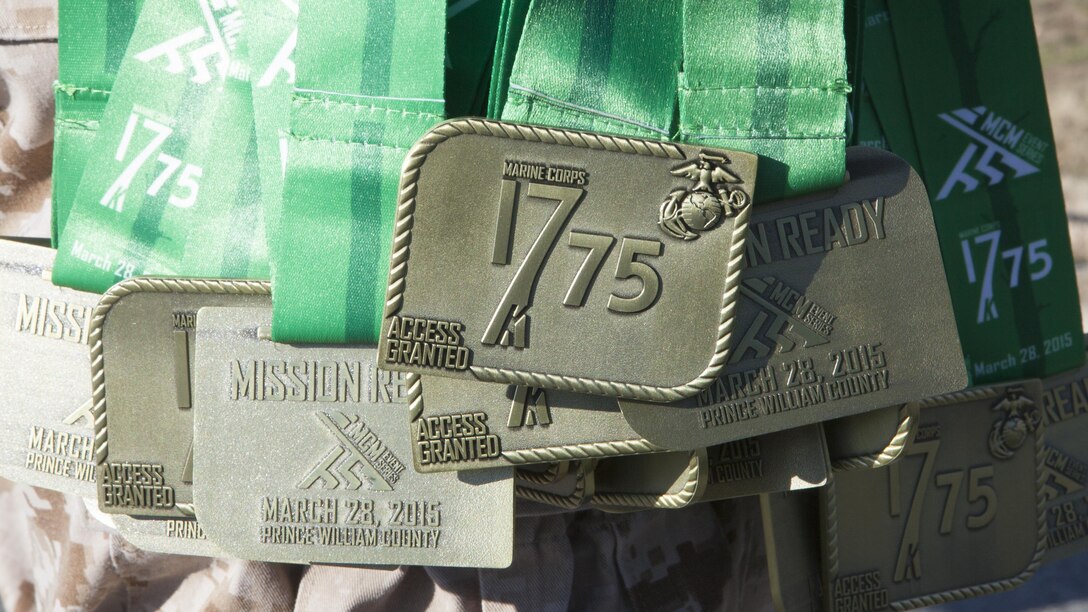 Finishers medals hang from the arm of a Marine waiting to present the medal to runners of the 17.75K race in Prince William Country, Virgninia March 28. More than 2000 runners participated in the race.