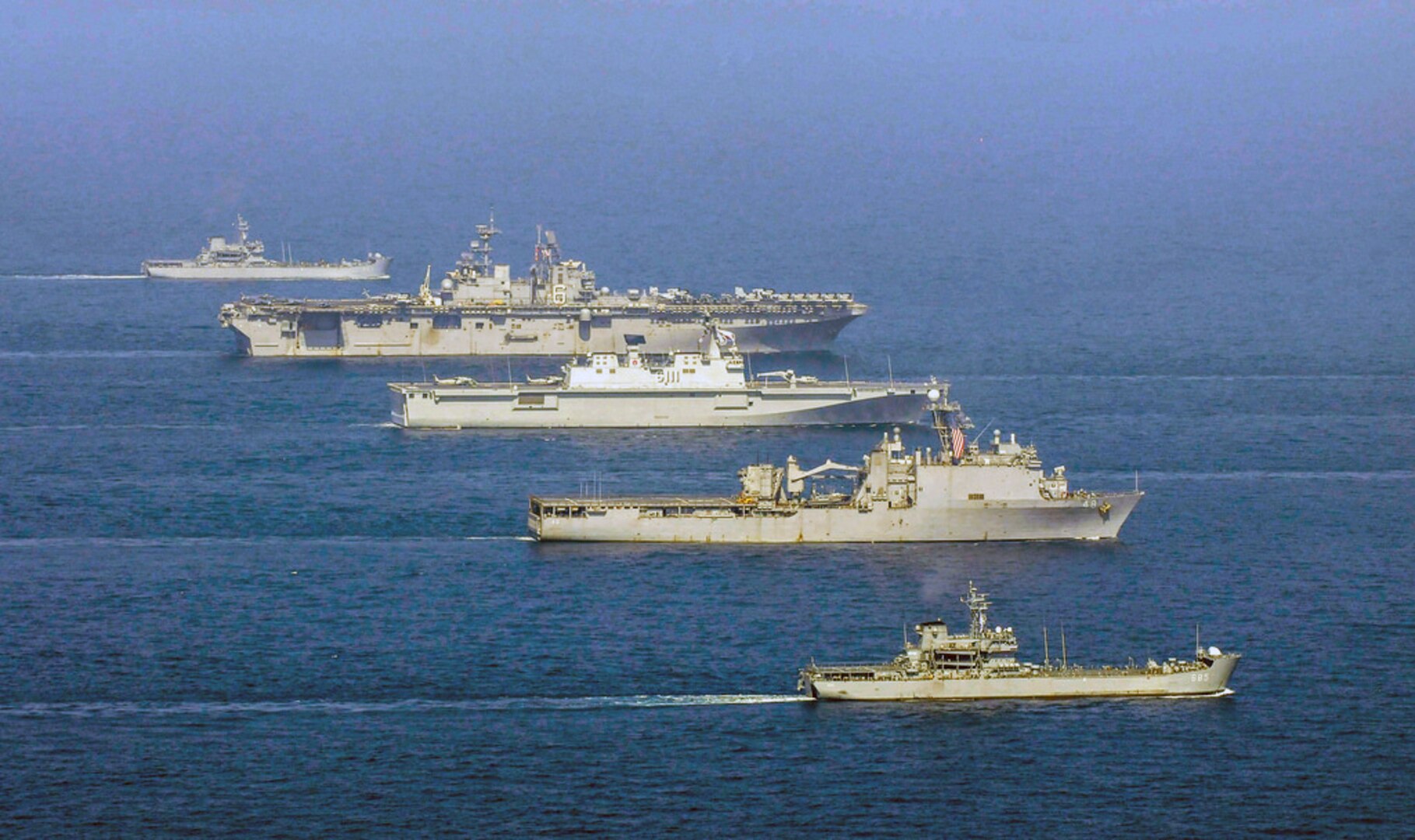 WATERS TO THE EAST OF THE KOREAN PENINSULA (Mar. 27, 2015) - The forward-deployed amphibious assault ship USS Bonhomme Richard (LHD 6) and forward-deployed dock landing ship USS Ashland (LSD 48) operate with Republic of Korea (ROK) Navy amphibious assault ship ROKS Dokdo (LPH 6111), ROKS Hyang Ro Bong (LST 683) and ROKS Sung In Bong (LST 685). U.S Sailors and Marines from the Bonhomme Richard Amphibious Ready Group (ARG), which also includes the the forward-deployed amphibious transport dock ship USS Green Bay (LPD 20), along with the 31st Marine Expeditionary Unit (MEU) are participating in the Korean Marine Exchange Program (KMEP) in the ROK with the ROK Marine Corps and Navy. 