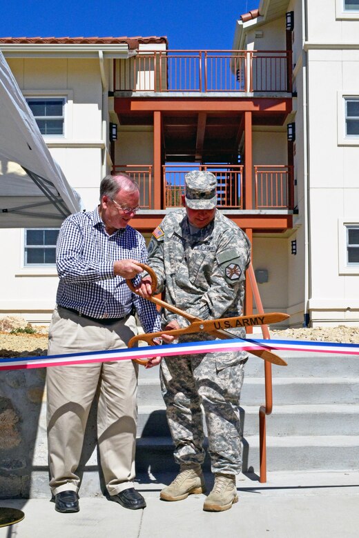 U.S. Rep. Sam Farr and Fort Hunter Liggett Commander Lt. Col. Michael B. Bailey cut the ribbon officially opening a new housing complex at the Monterey County, California, installation March 27, 2015. The U.S. Army Corps of Engineers Sacramento District managed the construction of the project. The new housing units are configured into three five-unit buildings, each designed to LEED-Silver energy efficiency standards to help the installation meet its net zero goals. One unit is designed for two soldiers with separate bathrooms and bedrooms. Construction began in November 2013 at a cost of about $4.5 million. 