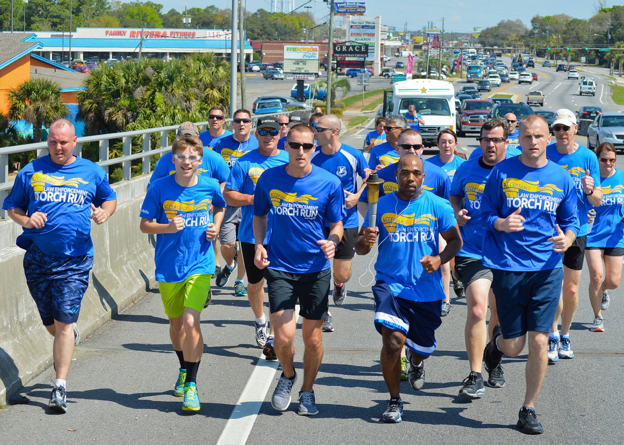 Members of the 96th Security Forces Squadron run with the official torch during the Law Enforcement Torch Run for Special Olympics Florida March 25 in Fort Walton Beach, Fla.  More than 20 security forces Airmen participated in the event running 5.25 miles and raising $356.  The 1,500 mile event spans across 67 Florida counties with more than 300 law enforcement runners.  The money raised goes to support Special Olympic athletes.  (Courtesy photo)