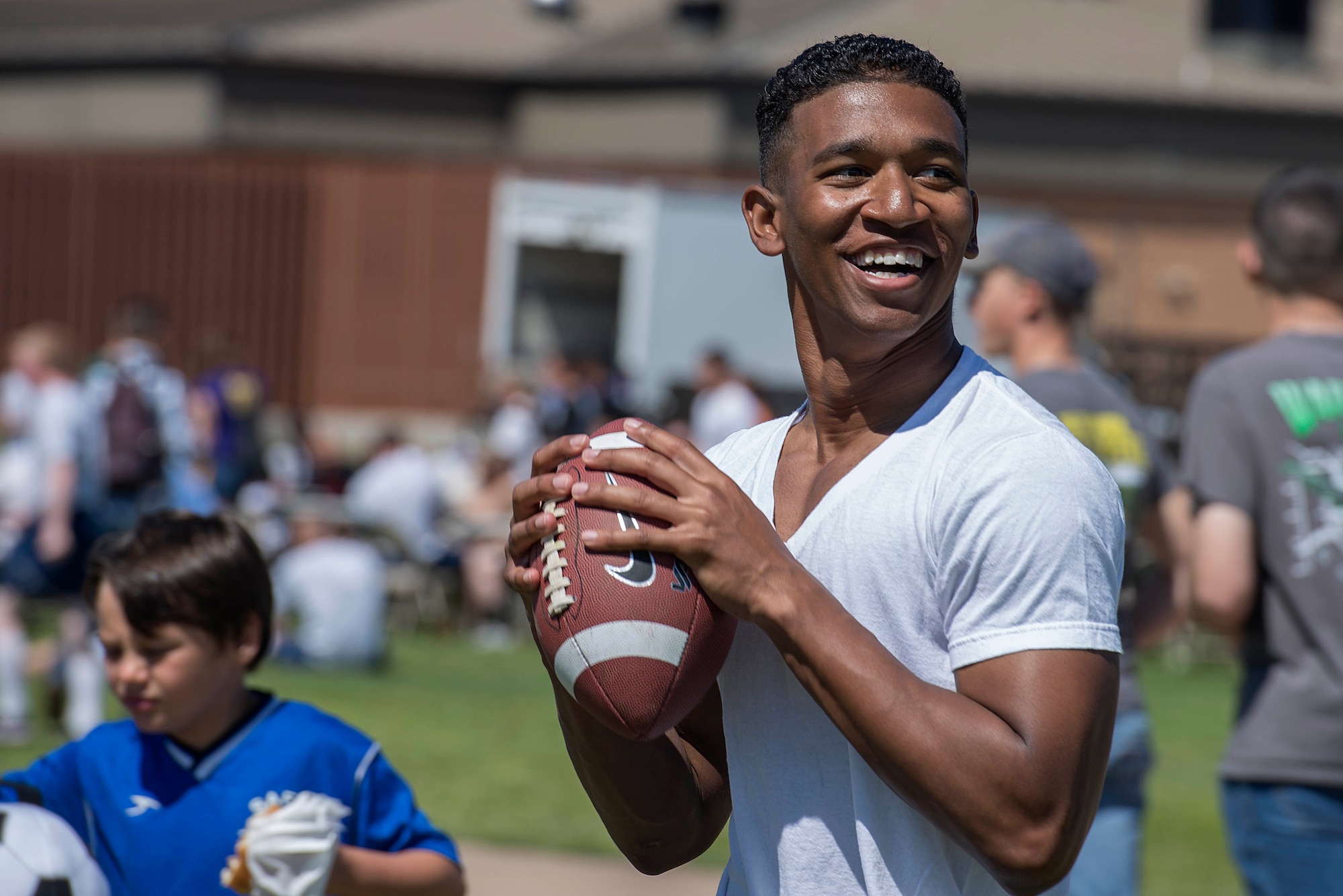 U.S. Air Force Airman 1st Class Brandon Edwards, 335th Training Squadron avionics test station and components student and native of Baldwin, N.Y., plays catch at the Sheppard Air Force Base, Texas, Spring Picnic March 28, 2015. More than 2,400 people attended the 2nd Sheppard Spring Picnic. (U.S. Air Force photo by Senior Airman Kyle Gese) 